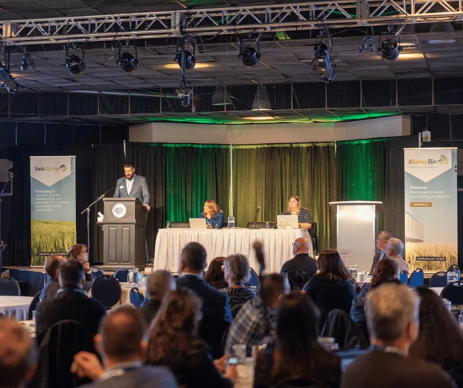 SaskBarley AGM, chair and staff on stage